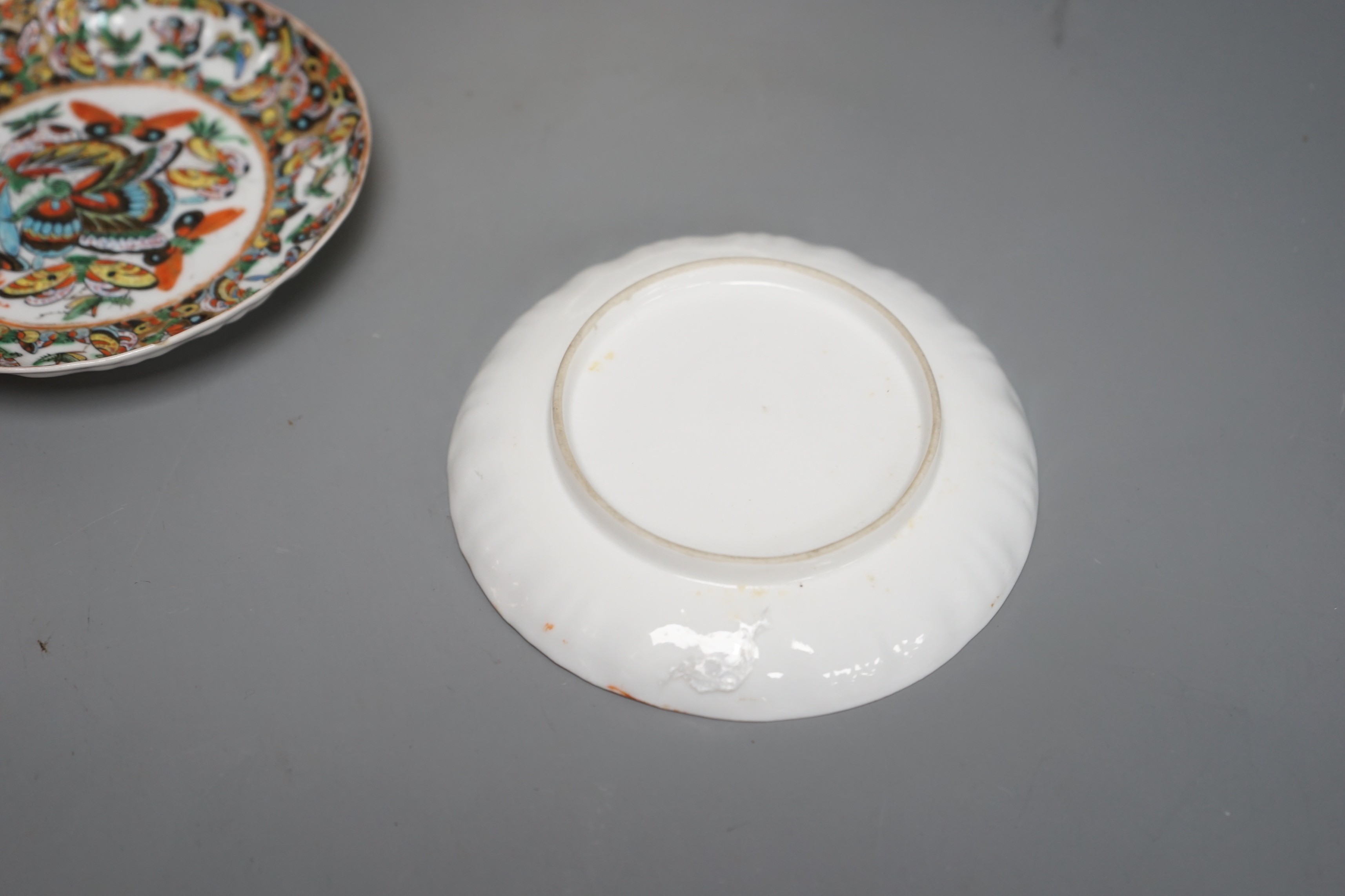 A Chinese 'thousand butterfly' dish and two saucers, early 20th century and three later Chinese coral round bowls, largest 20cm diameter